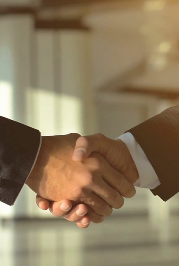 videoblocks-the-two-business-people-handshake-on-the-sunny-background-slow-motion_rbciusjez_thumbnail-1080_01